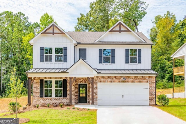 view of front of house with a garage and a front yard