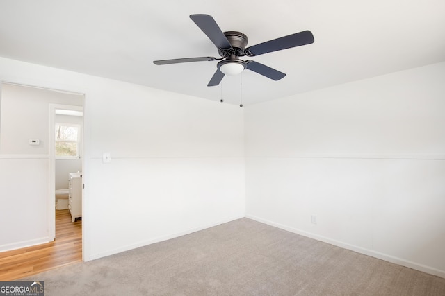 unfurnished room featuring ceiling fan and light colored carpet