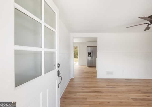 hallway featuring light wood-type flooring