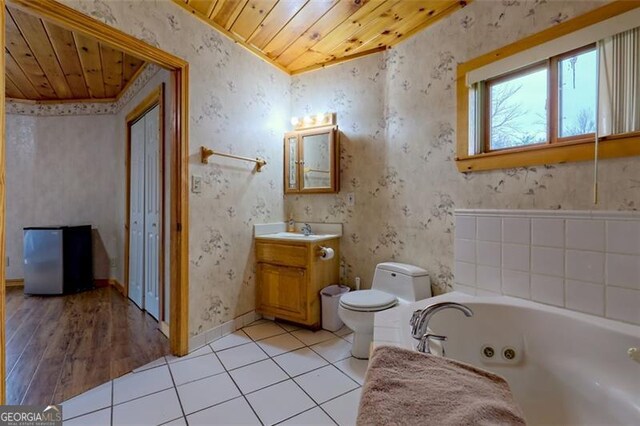 bathroom featuring vanity, wood ceiling, tile patterned floors, and toilet