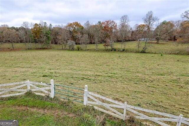 view of yard with a rural view