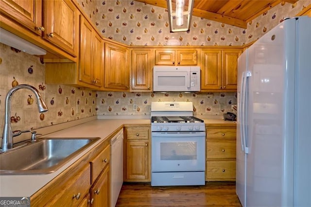 kitchen featuring lofted ceiling, sink, wooden ceiling, dark hardwood / wood-style floors, and white appliances