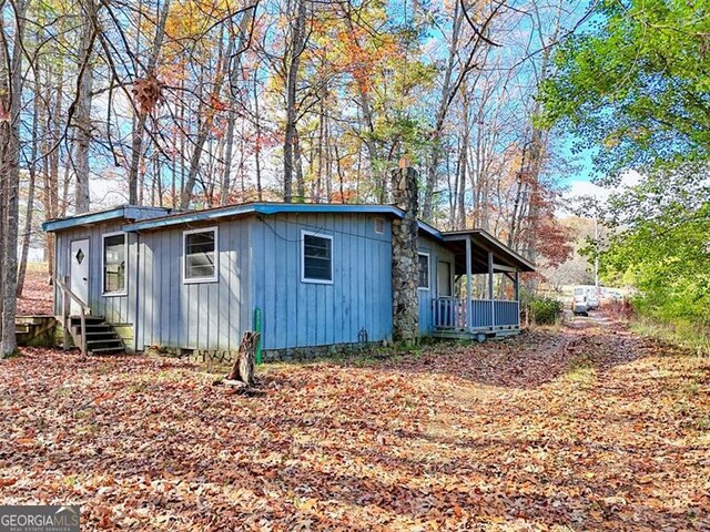 view of outbuilding with covered porch