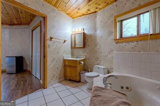 bathroom with vanity, tile patterned floors, wooden ceiling, and toilet