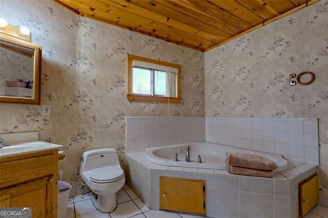 bathroom featuring tile patterned floors, toilet, wooden ceiling, vanity, and a relaxing tiled tub