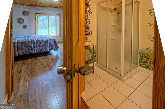 bathroom with hardwood / wood-style flooring