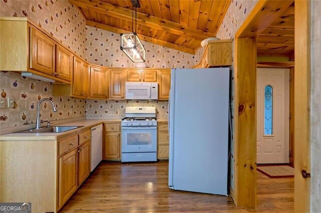 kitchen featuring pendant lighting, sink, white appliances, vaulted ceiling with beams, and wooden ceiling