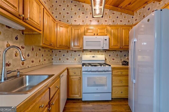 kitchen with lofted ceiling, sink, wood ceiling, dark hardwood / wood-style floors, and white appliances