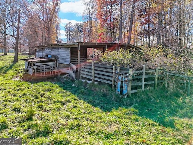 back of property with an outbuilding