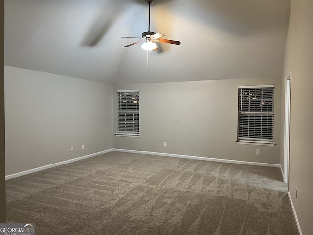 spare room with ceiling fan, carpet flooring, and lofted ceiling