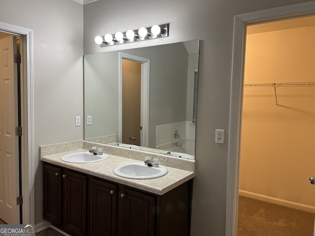 bathroom featuring vanity and a bathing tub