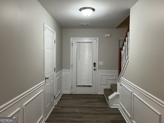 doorway featuring dark wood-type flooring