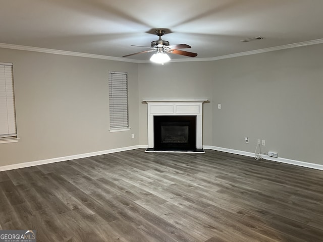 unfurnished living room with crown molding, dark wood-type flooring, and ceiling fan