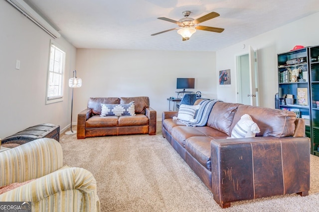 carpeted living room featuring ceiling fan