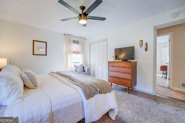 carpeted bedroom featuring a closet and ceiling fan