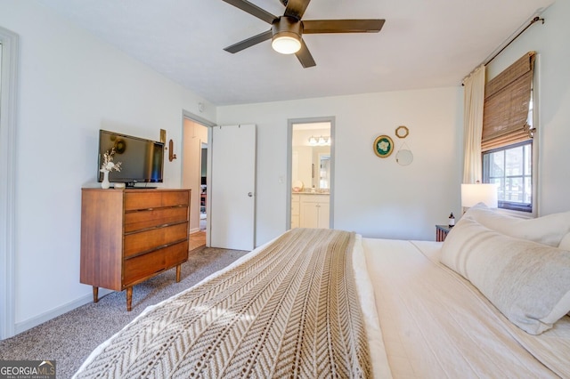 bedroom with ceiling fan, connected bathroom, and carpet floors