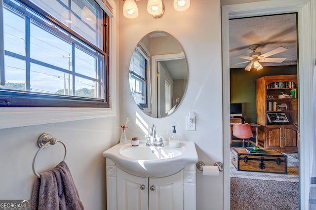 bathroom featuring ceiling fan and vanity