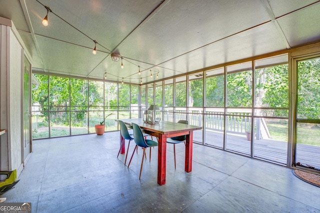 unfurnished sunroom featuring a healthy amount of sunlight