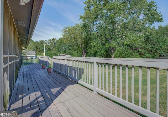 deck featuring a yard