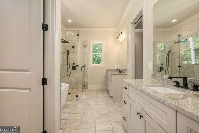 bathroom featuring independent shower and bath, ornamental molding, and vanity