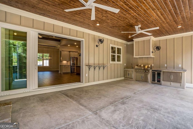 view of patio / terrace featuring a sink, area for grilling, wine cooler, and ceiling fan