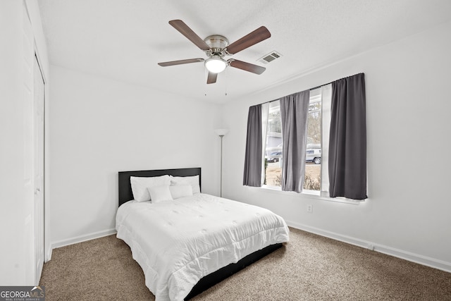 carpeted bedroom featuring ceiling fan