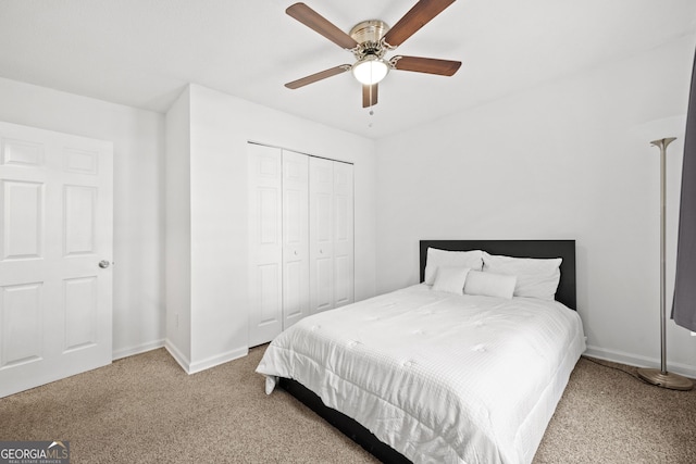 bedroom featuring ceiling fan, carpet floors, and a closet