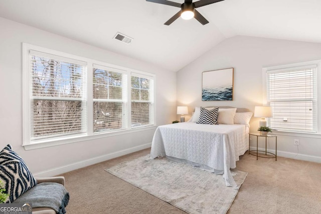 bedroom with lofted ceiling, light colored carpet, and ceiling fan