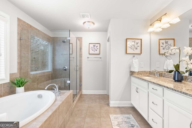 bathroom featuring separate shower and tub, tile patterned floors, and vanity