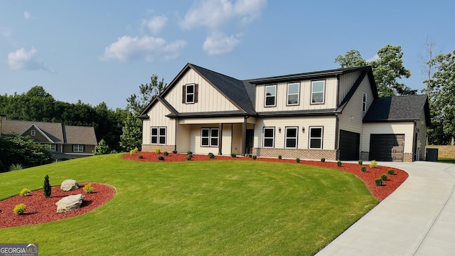 526 Whirlway St, Jefferson, GA 30549 - view of front of house with driveway, board and batten siding, a front yard, an attached garage, and brick siding