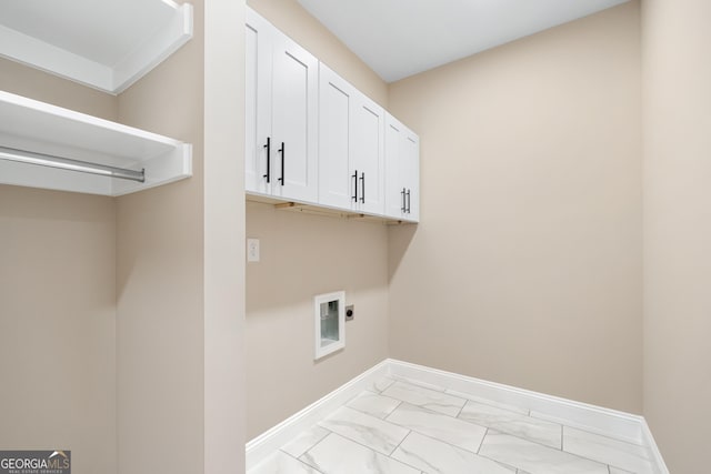526 Whirlway St, Jefferson, GA 30549 - washroom featuring electric dryer hookup, light marble finish floors, baseboards, and cabinet space