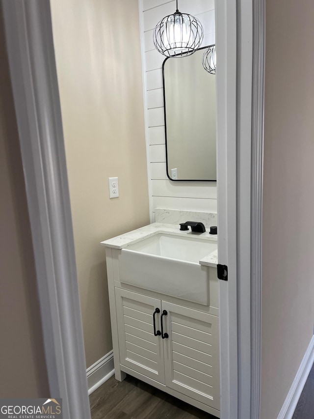 bathroom with wood-type flooring and vanity