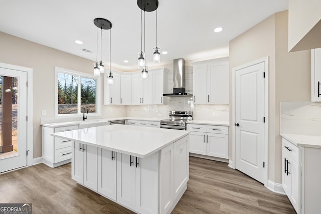 526 Whirlway St, Jefferson, GA 30549 - kitchen featuring wall chimney range hood, appliances with stainless steel finishes, a sink, decorative backsplash, and recessed lighting