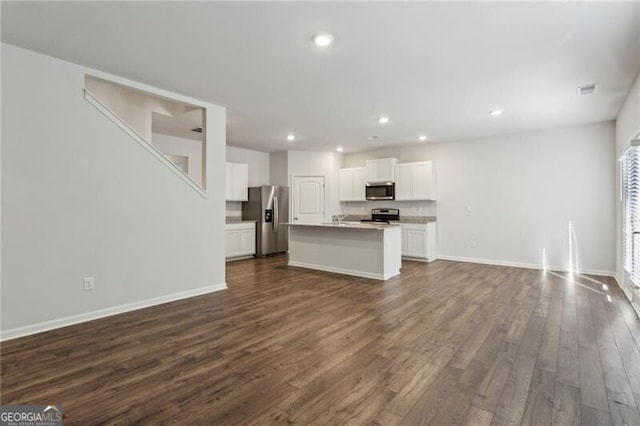 unfurnished living room featuring dark hardwood / wood-style flooring