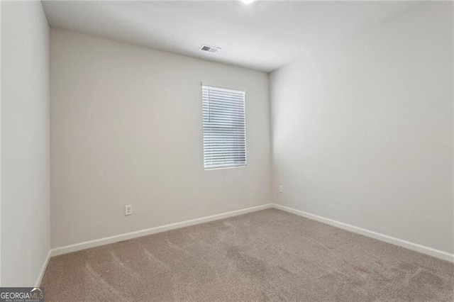 spare room featuring carpet flooring