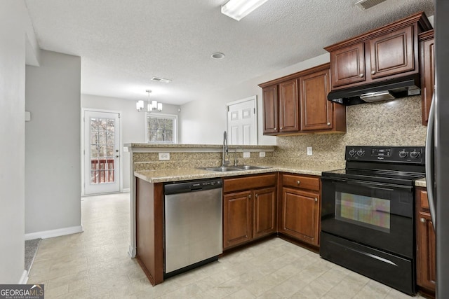 kitchen with sink, appliances with stainless steel finishes, tasteful backsplash, light stone countertops, and kitchen peninsula