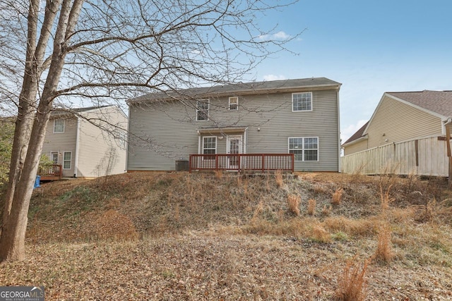 rear view of house featuring a deck