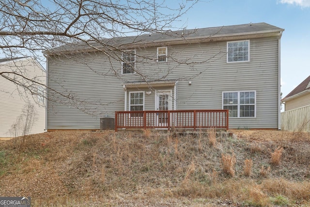 rear view of house featuring a deck