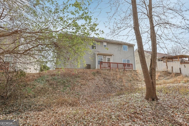 back of property featuring a deck