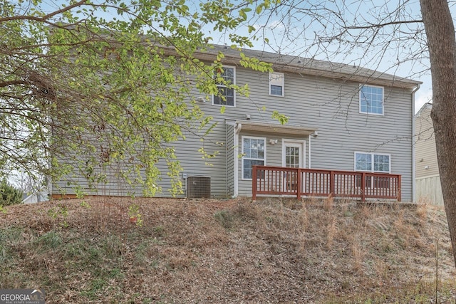 back of property with a wooden deck and central air condition unit