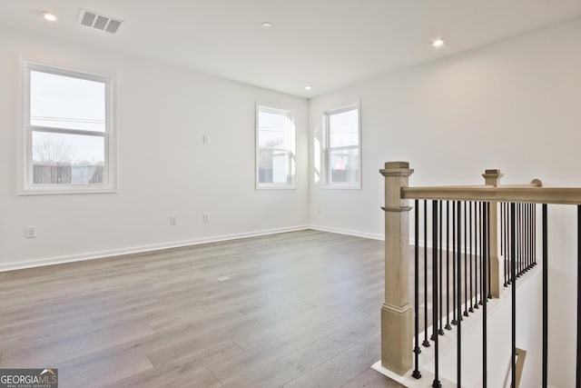 spare room featuring light hardwood / wood-style flooring