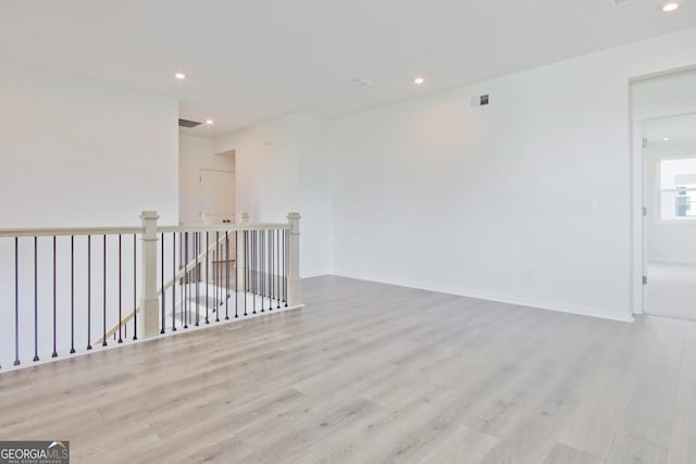 spare room with light wood-type flooring