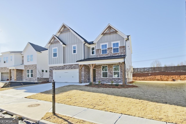 craftsman inspired home with a garage and covered porch