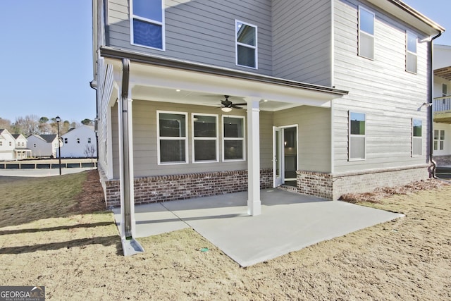 rear view of house featuring a patio area and ceiling fan