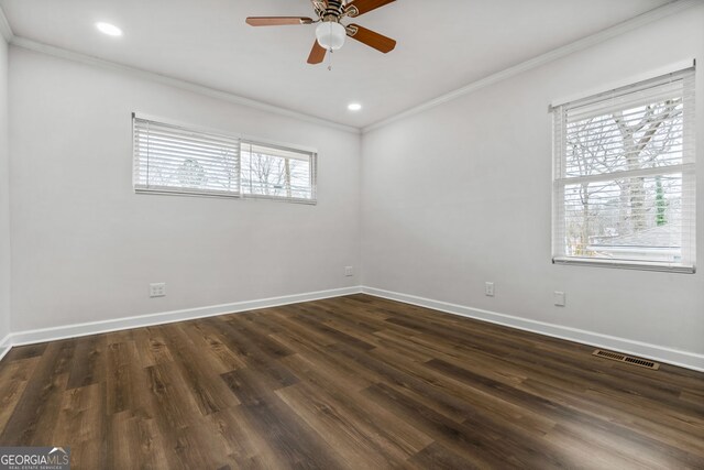 unfurnished room featuring ceiling fan, dark hardwood / wood-style flooring, and ornamental molding