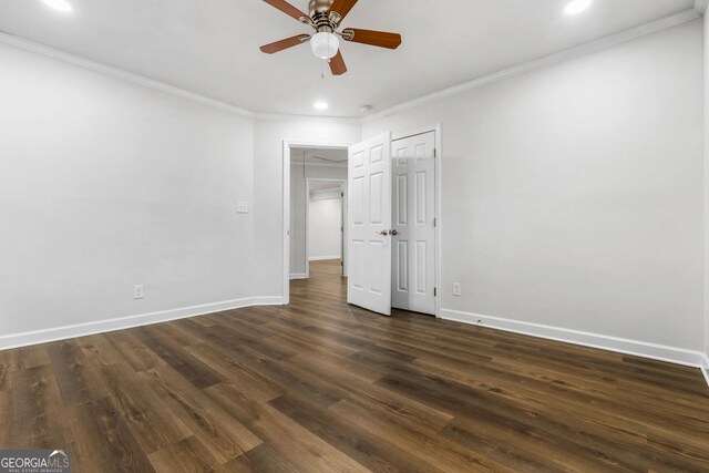 unfurnished bedroom featuring ceiling fan, ornamental molding, and dark hardwood / wood-style floors