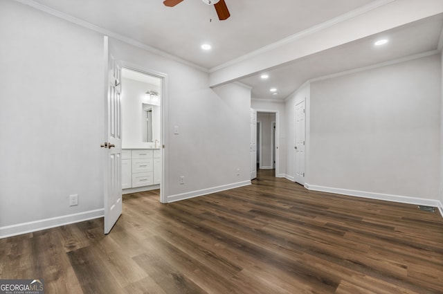 unfurnished bedroom featuring dark hardwood / wood-style flooring, connected bathroom, ceiling fan, and ornamental molding