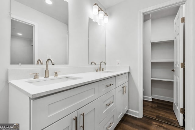 bathroom with vanity and hardwood / wood-style floors