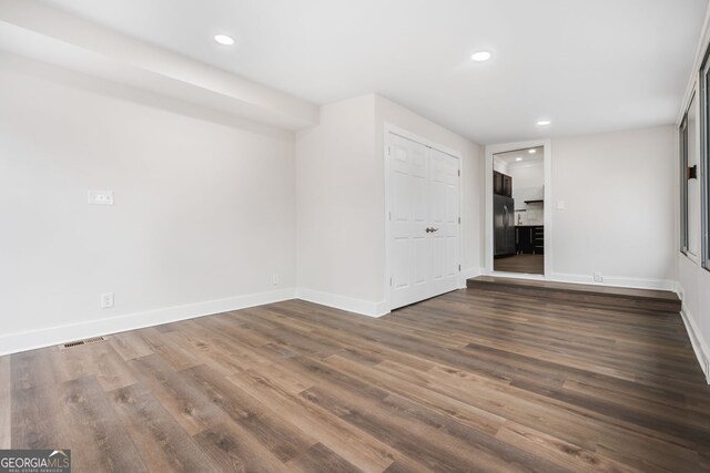 kitchen featuring appliances with stainless steel finishes, sink, backsplash, ornamental molding, and light hardwood / wood-style flooring