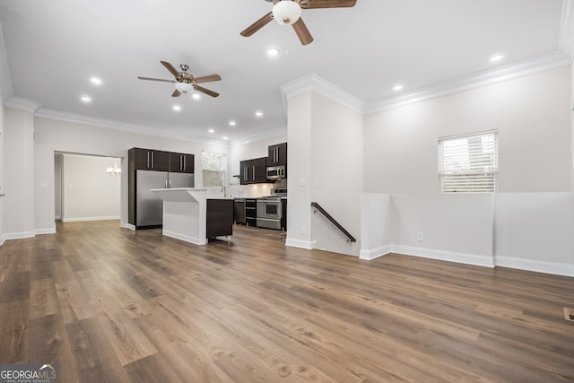 kitchen featuring wood-type flooring, crown molding, a center island, and stainless steel appliances